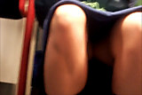 Upskirt on tube, reading her thighs