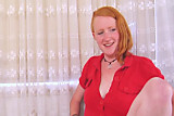 Redhead with furry bush and pits poses solo