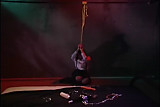 Lesbian BDSM  Clothed woman in bondage is stripped