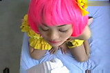 Asian girl with pink wig gives head