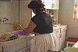Mature wife cleaning the house