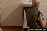 Blonde with a dildo at the gloryhole